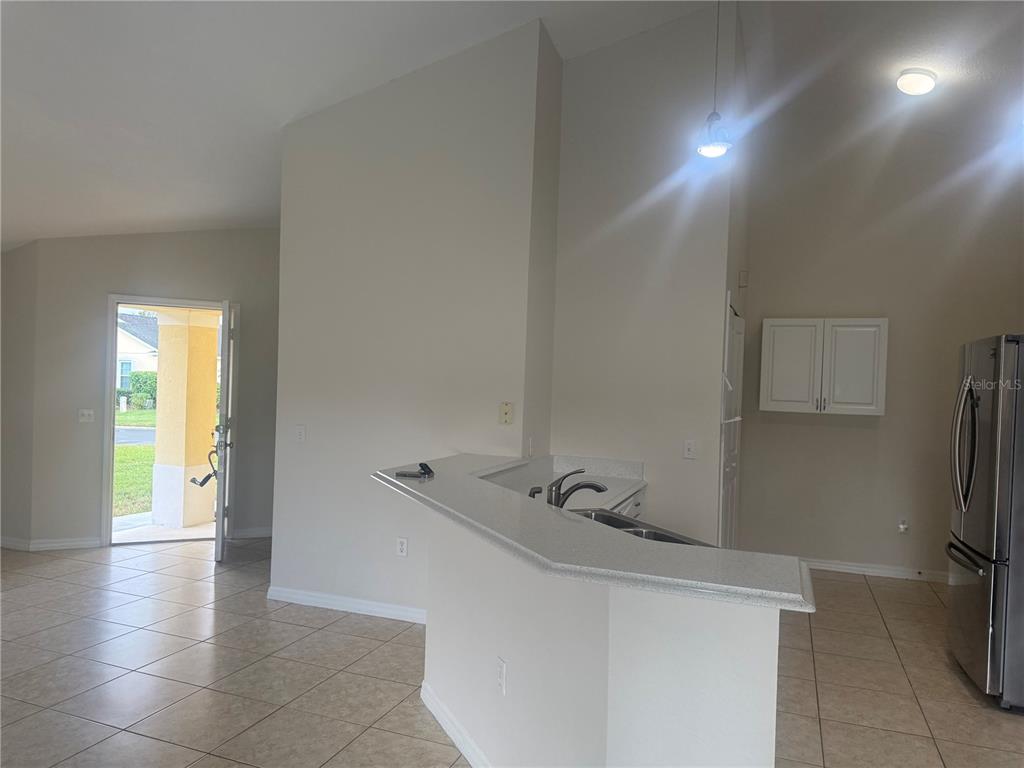 927 Reserve Place Davenport, FL 33896 - Photo 5 of 18 a view of entryway with workspace