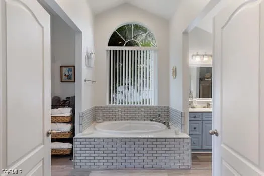 a bathroom with a bathtub and a shower