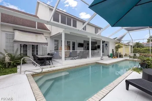 a view of a swimming pool with chairs