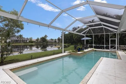 a view of a swimming pool with a patio