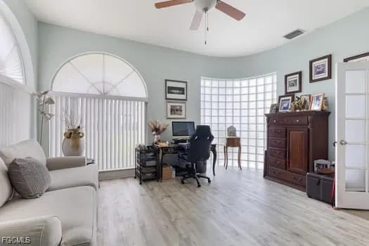 a livingroom with workspace window and a couch