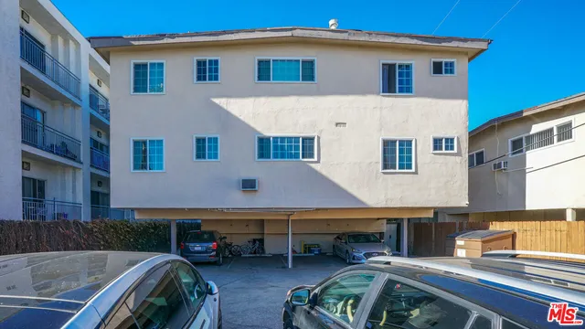 a front view of house with yard outdoor seating and barbeque oven