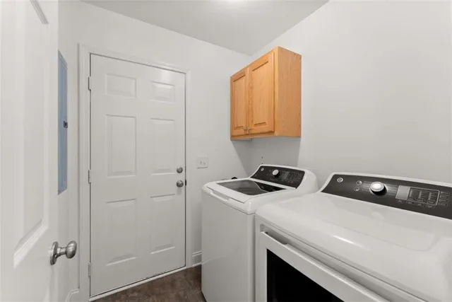 a utility room with dryer and washer