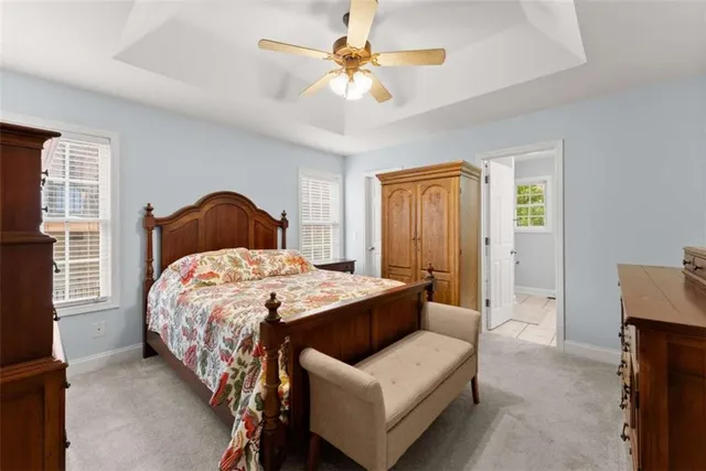 a bedroom with a bed tub and window