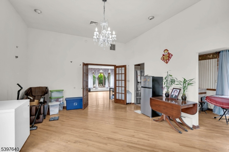 699 East Shore Road West Milford, NJ 07421 - Photo 14 of 50 a living room with furniture and a chandelier