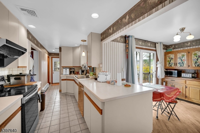 699 East Shore Road West Milford, NJ 07421 - Photo 18 of 50 a large white kitchen with lots of counter top space