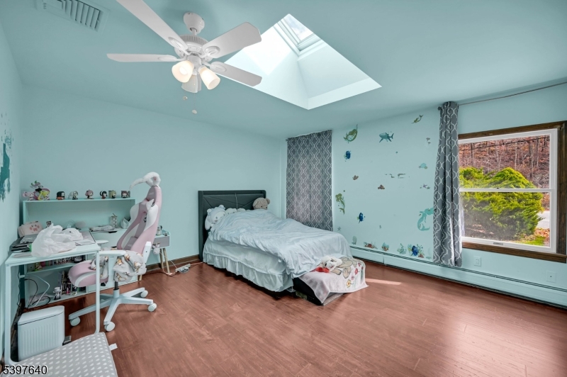 699 East Shore Road West Milford, NJ 07421 - Photo 30 of 50 a bedroom with a bed and a window