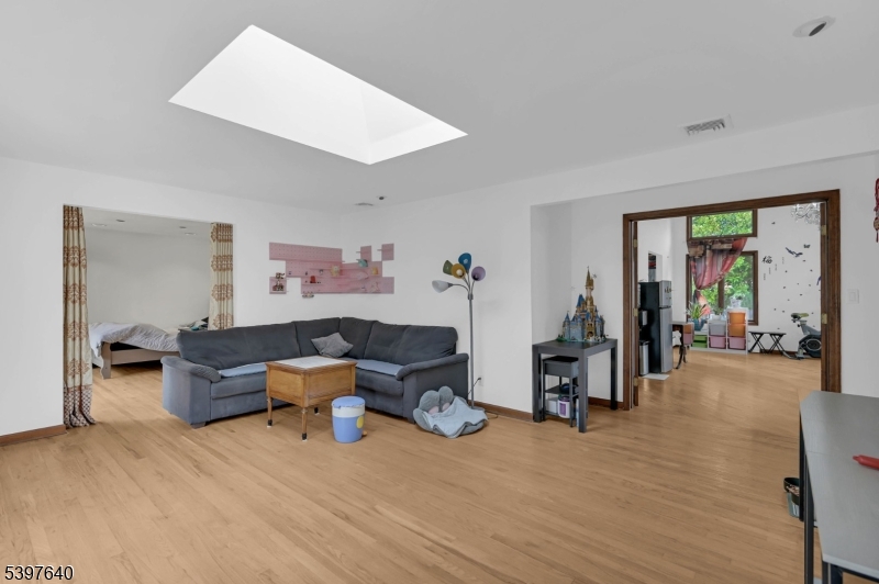 699 East Shore Road West Milford, NJ 07421 - Photo 3 of 50 a living room with furniture and a wooden floor