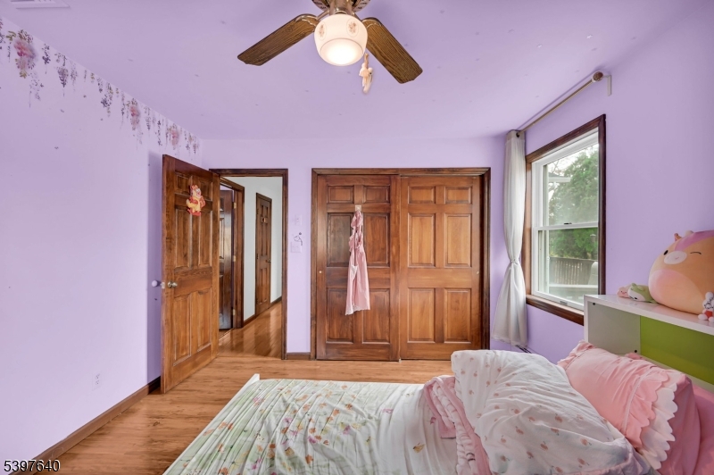 699 East Shore Road West Milford, NJ 07421 - Photo 33 of 50 a bedroom with a bed and a chandelier