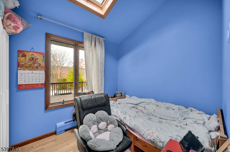 699 East Shore Road West Milford, NJ 07421 - Photo 34 of 50 a bedroom with a bed and a window