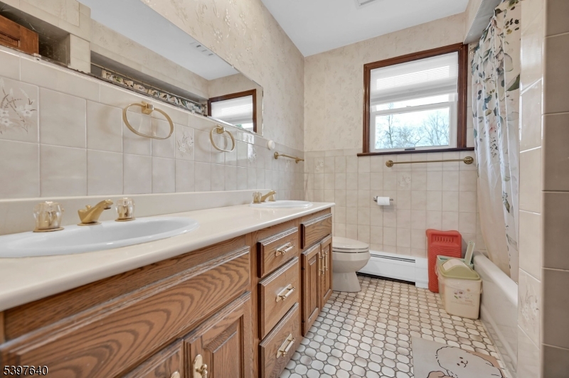 699 East Shore Road West Milford, NJ 07421 - Photo 35 of 50 a bathroom with a sink a toilet and a shower