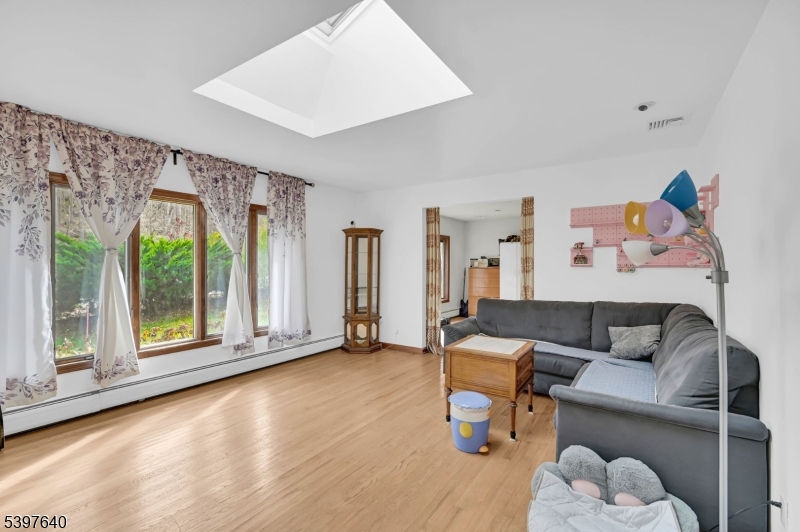 699 East Shore Road West Milford, NJ 07421 - Photo 4 of 50 a living room with furniture and a large window