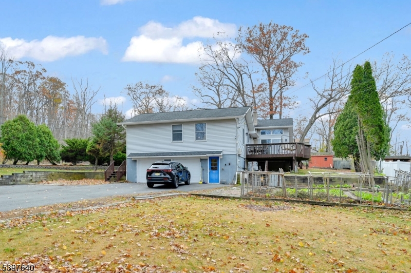 699 East Shore Road West Milford, NJ 07421 - Photo 45 of 50 a car parked in front of a house