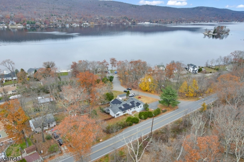 699 East Shore Road West Milford, NJ 07421 - Photo 49 of 50 an aerial view of a house with a lake view