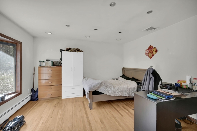 699 East Shore Road West Milford, NJ 07421 - Photo 8 of 50 a bedroom with furniture and a window