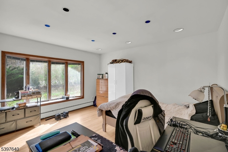 699 East Shore Road West Milford, NJ 07421 - Photo 9 of 50 a view of a living room with furniture and floor to ceiling window