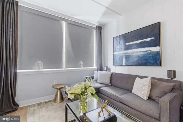 a bedroom with a bed and a lamp