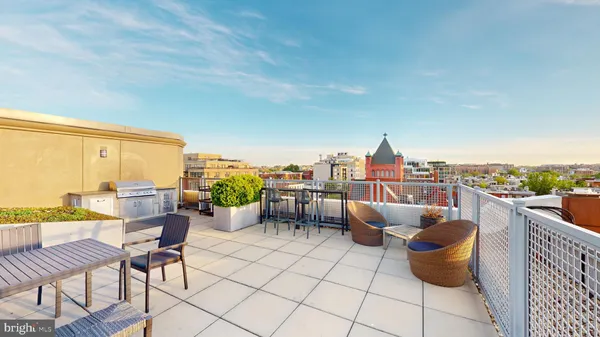 a view of a terrace with furniture