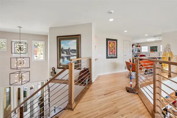 a view of a livingroom with furniture and hardwood floor