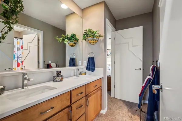a bathroom with a sink double vanity and a mirror