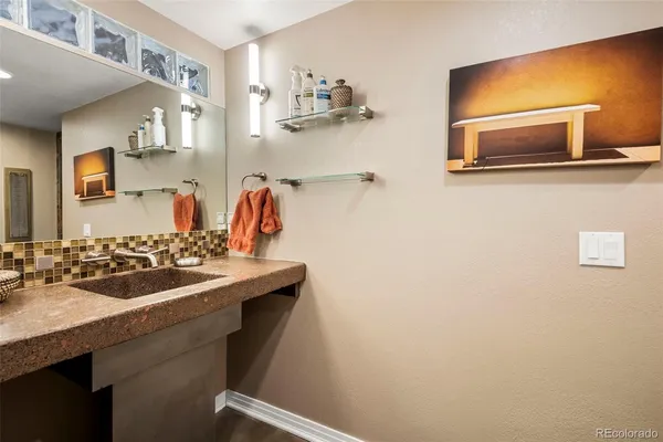 a bathroom with a sink and a mirror