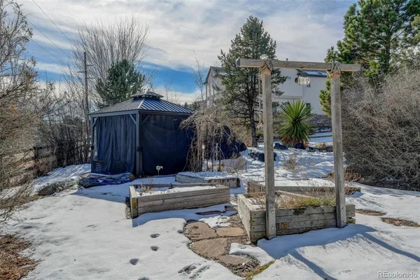 a view of a backyard with sitting area