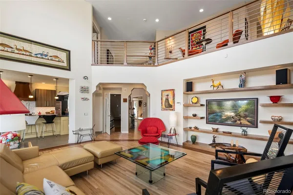 a living room with furniture and flat screen tv