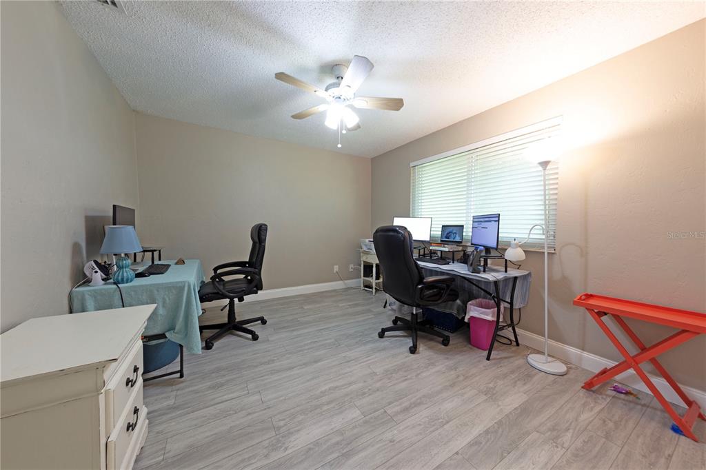232 North Ridgewood Avenue, Unit 3A Edgewater, FL 32132 - Photo 12 of 19 a view of a workspace with furniture and a window