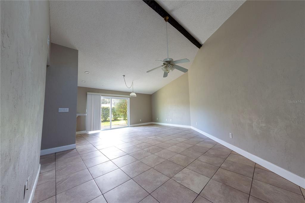 232 North Ridgewood Avenue, Unit 3A Edgewater, FL 32132 - Photo 3 of 19 an empty room with windows and fan