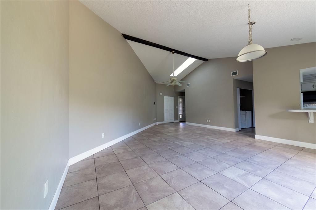 232 North Ridgewood Avenue, Unit 3A Edgewater, FL 32132 - Photo 4 of 19 a view of an empty room with a window
