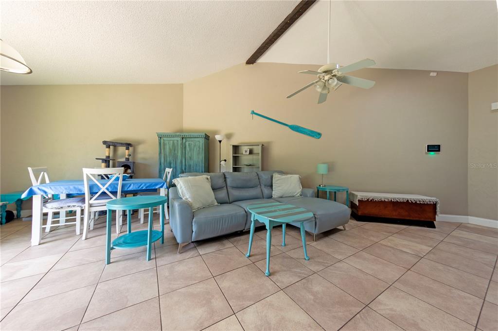 232 North Ridgewood Avenue, Unit 3A Edgewater, FL 32132 - Photo 4 of 19 a living room with furniture a air conditioner vent and a window