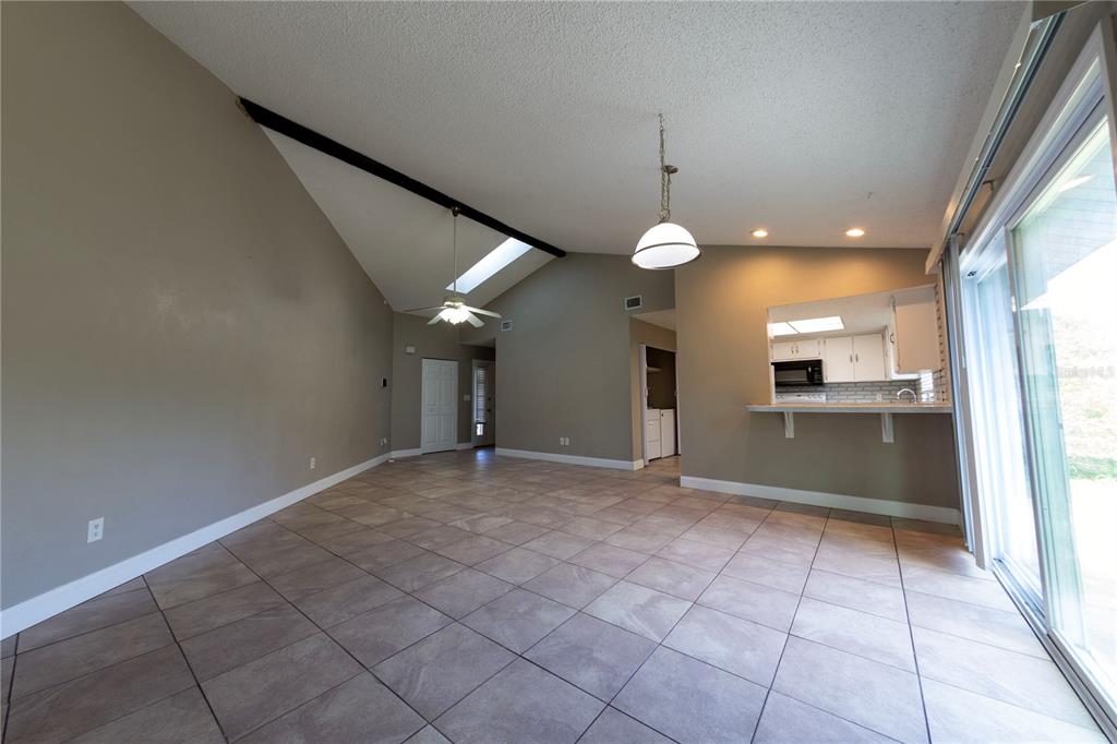 232 North Ridgewood Avenue, Unit 3A Edgewater, FL 32132 - Photo 5 of 19 a view of a hallway with a kitchen