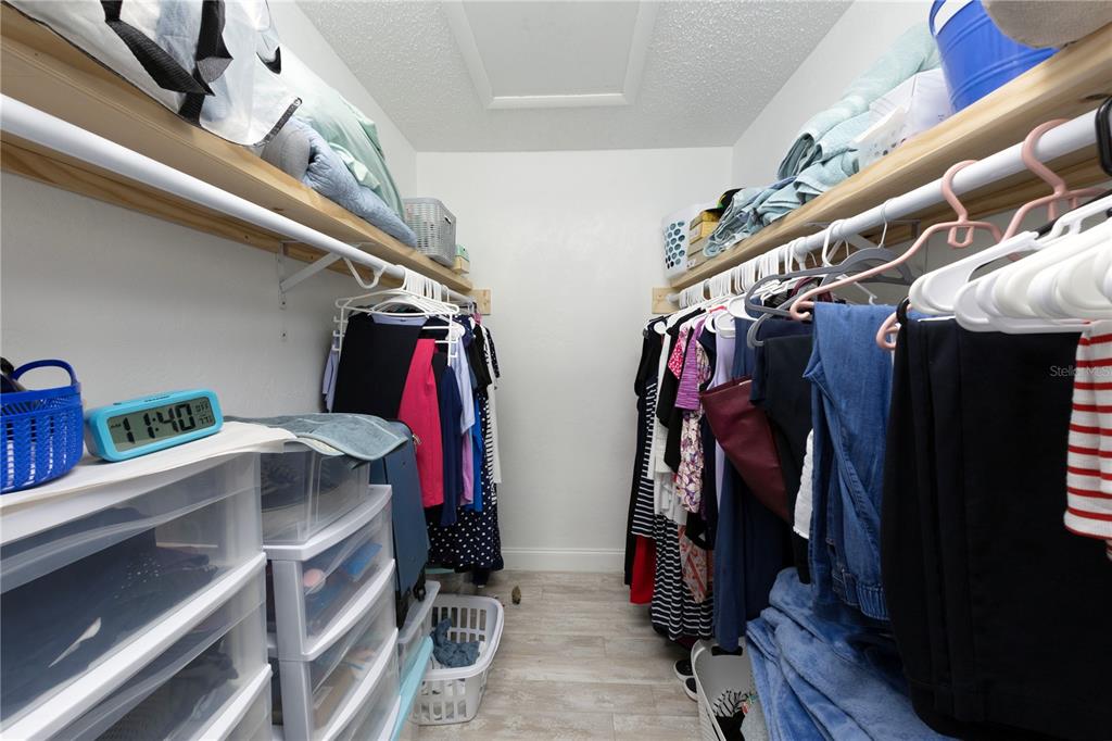 232 North Ridgewood Avenue, Unit 3A Edgewater, FL 32132 - Photo 10 of 19 a view of walk in closet with clothes and shoes
