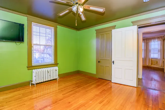a view of an entryway door with wooden floor