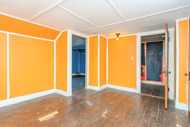 a view of a porch with a door and deck