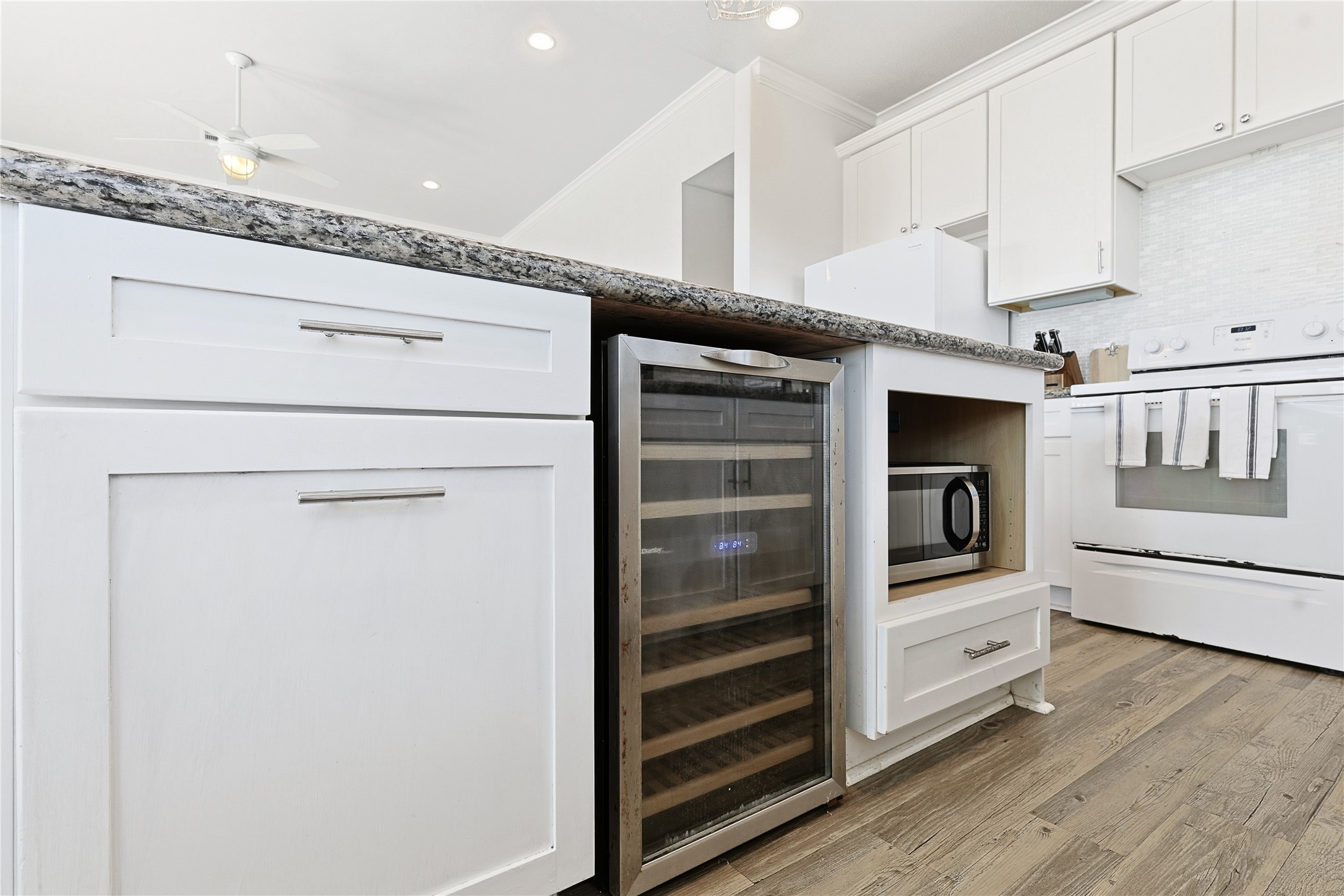 4414 Palm Street Freeport, TX 77541 - Photo 11 of 35 a kitchen with stainless steel appliances a white cabinet and a stove top oven