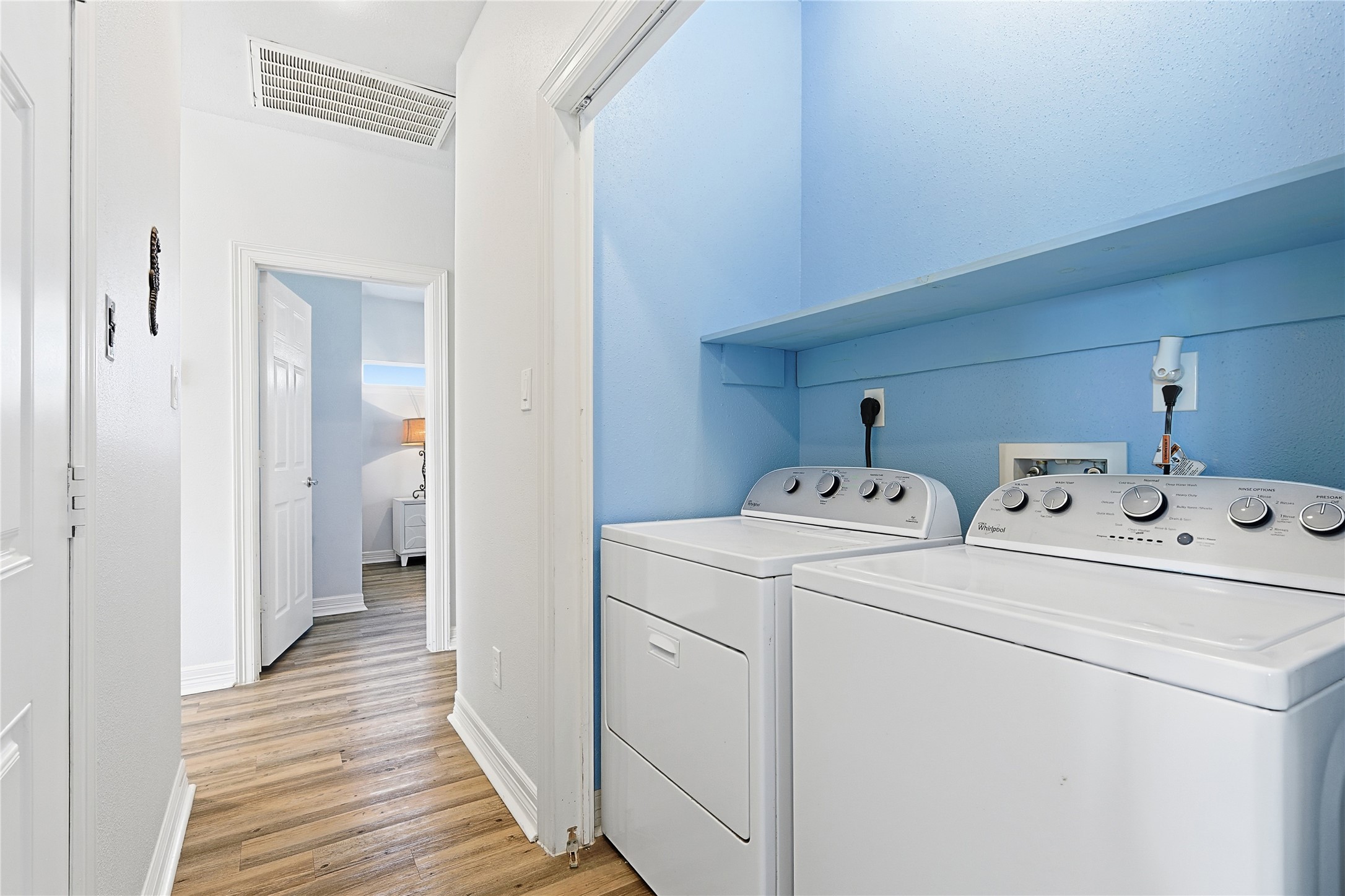 4414 Palm Street Freeport, TX 77541 - Photo 14 of 35 a view of storage and utility room with washer and dryer