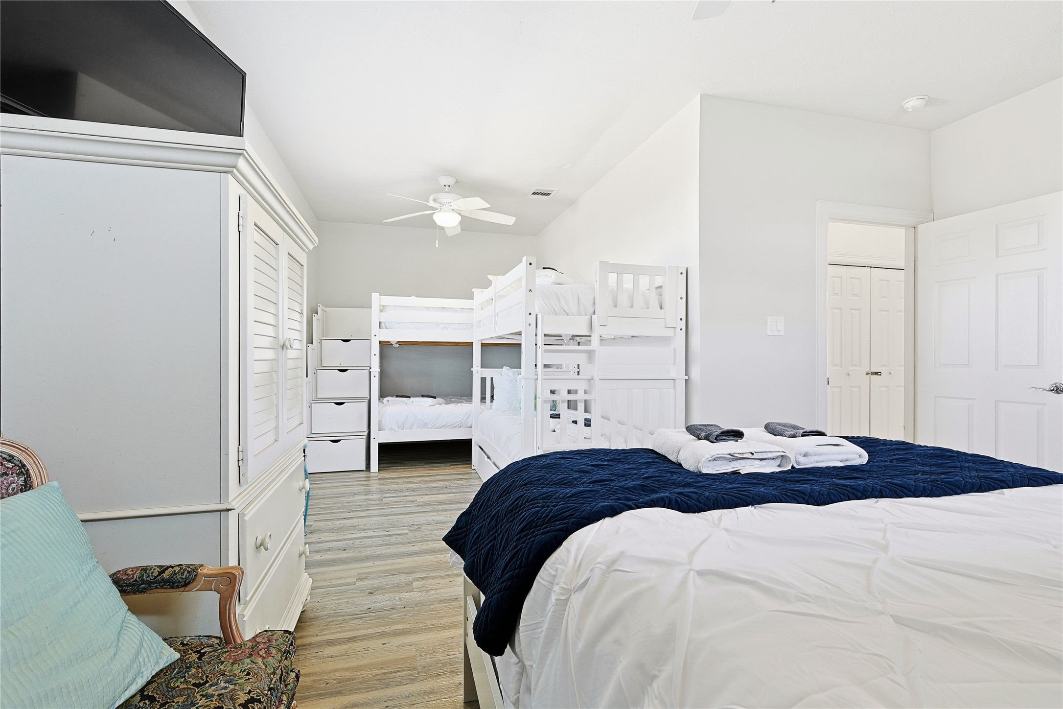 4414 Palm Street Freeport, TX 77541 - Photo 16 of 35 a bedroom with a bed and a view of en suite bathroom