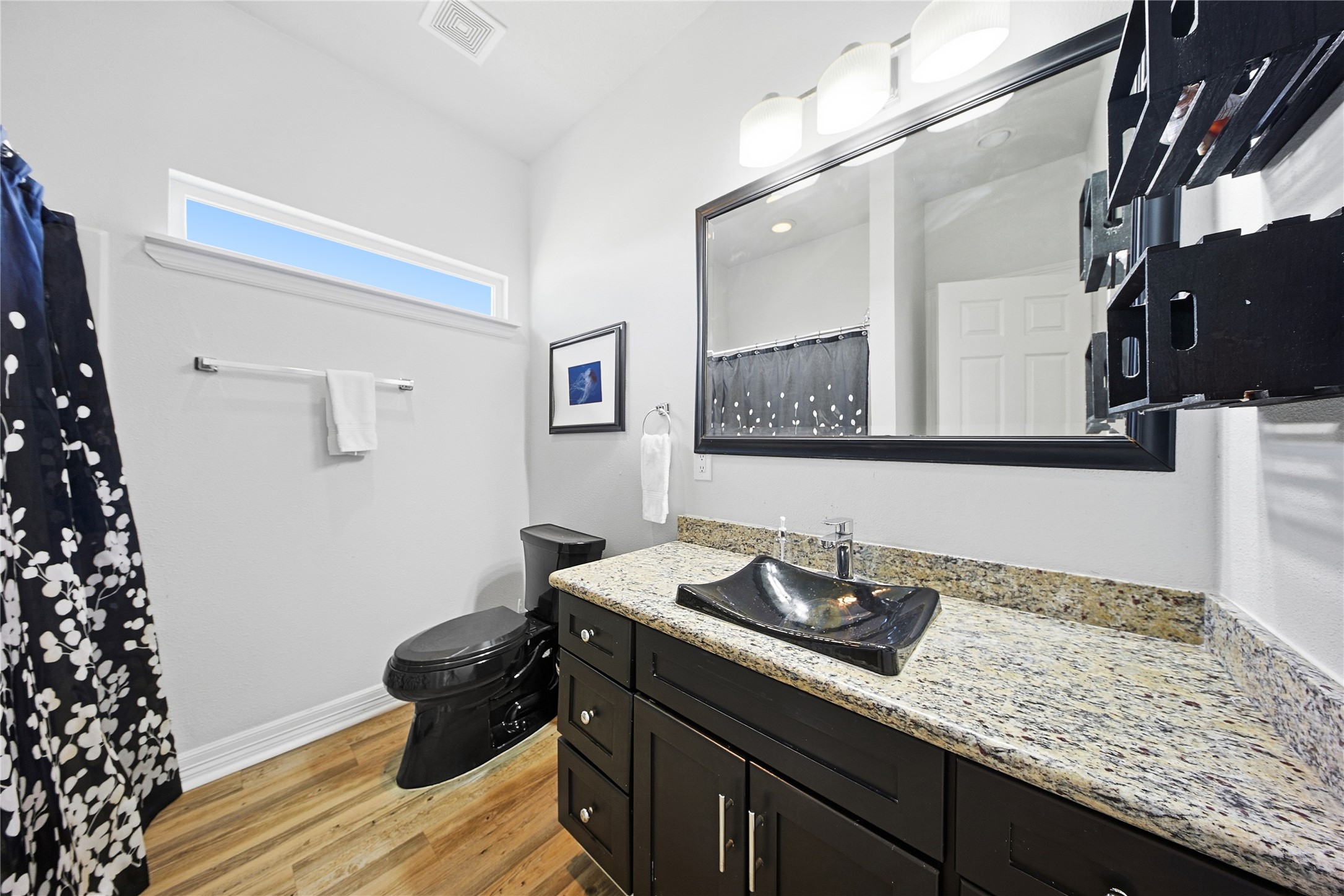 4414 Palm Street Freeport, TX 77541 - Photo 19 of 35 a bathroom with a sink and a mirror