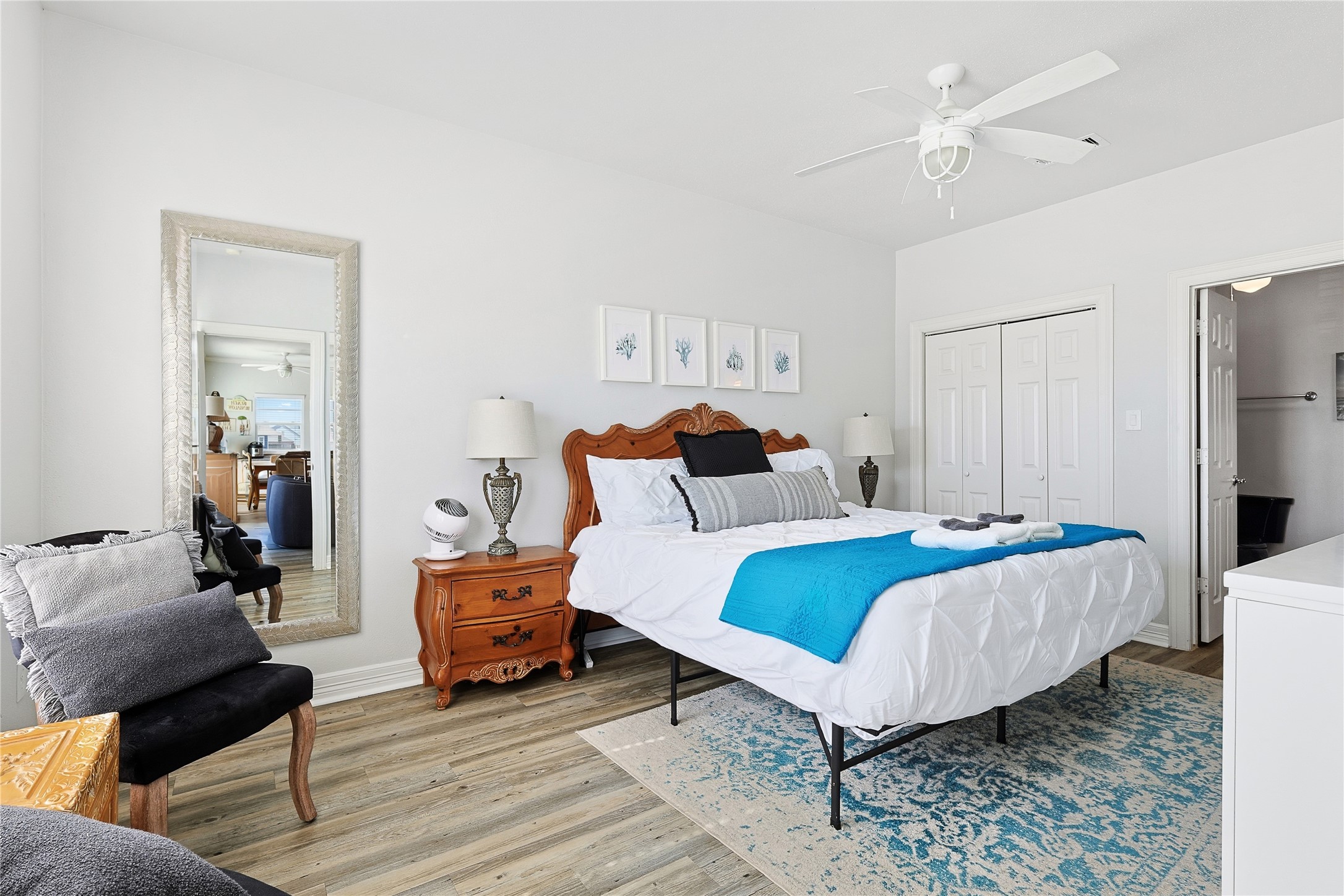 4414 Palm Street Freeport, TX 77541 - Photo 20 of 35 a bedroom with a bed and wooden floor