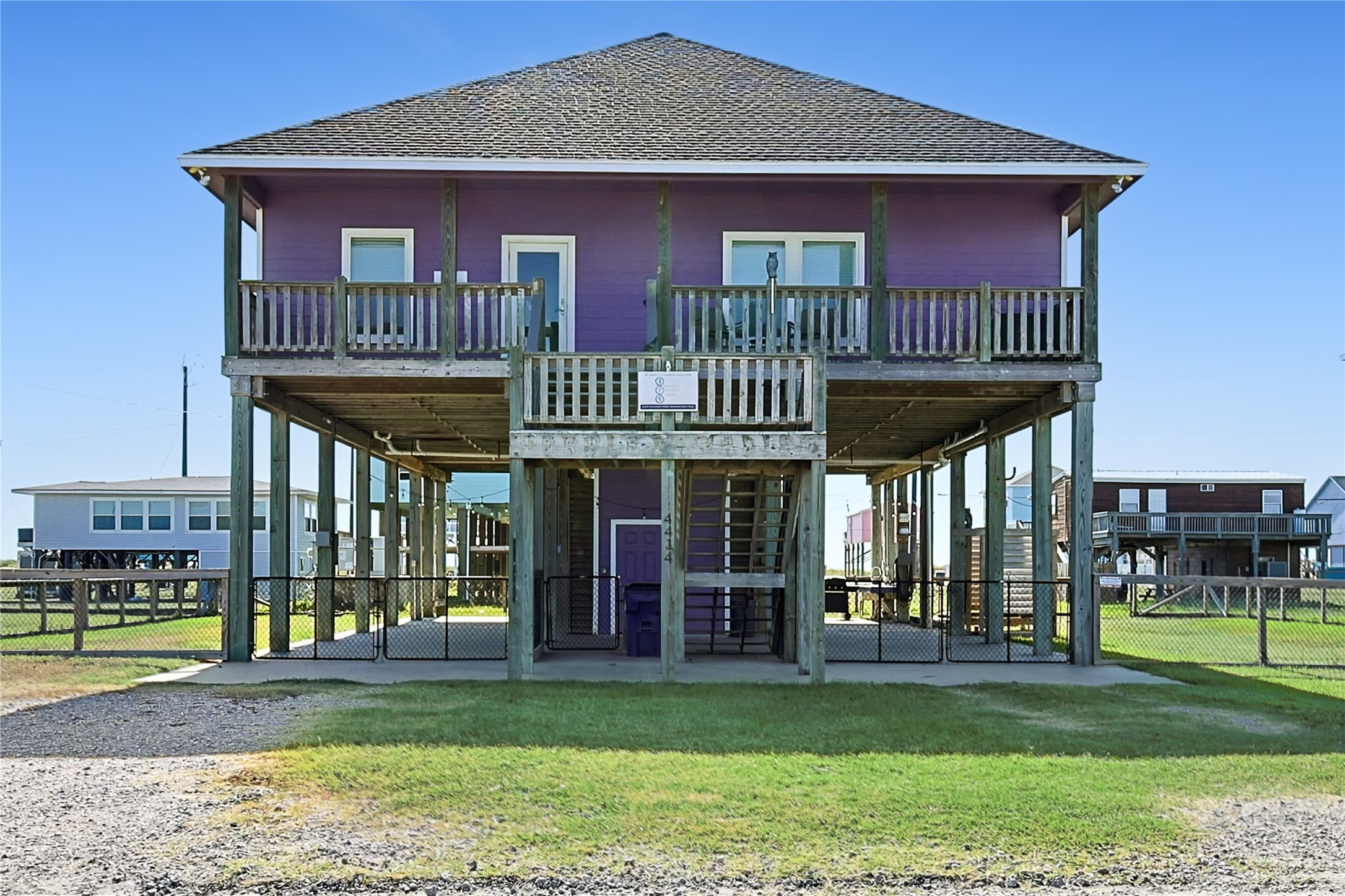 4414 Palm Street Freeport, TX 77541 - Photo 2 of 35 a view of a house with a deck and a yard
