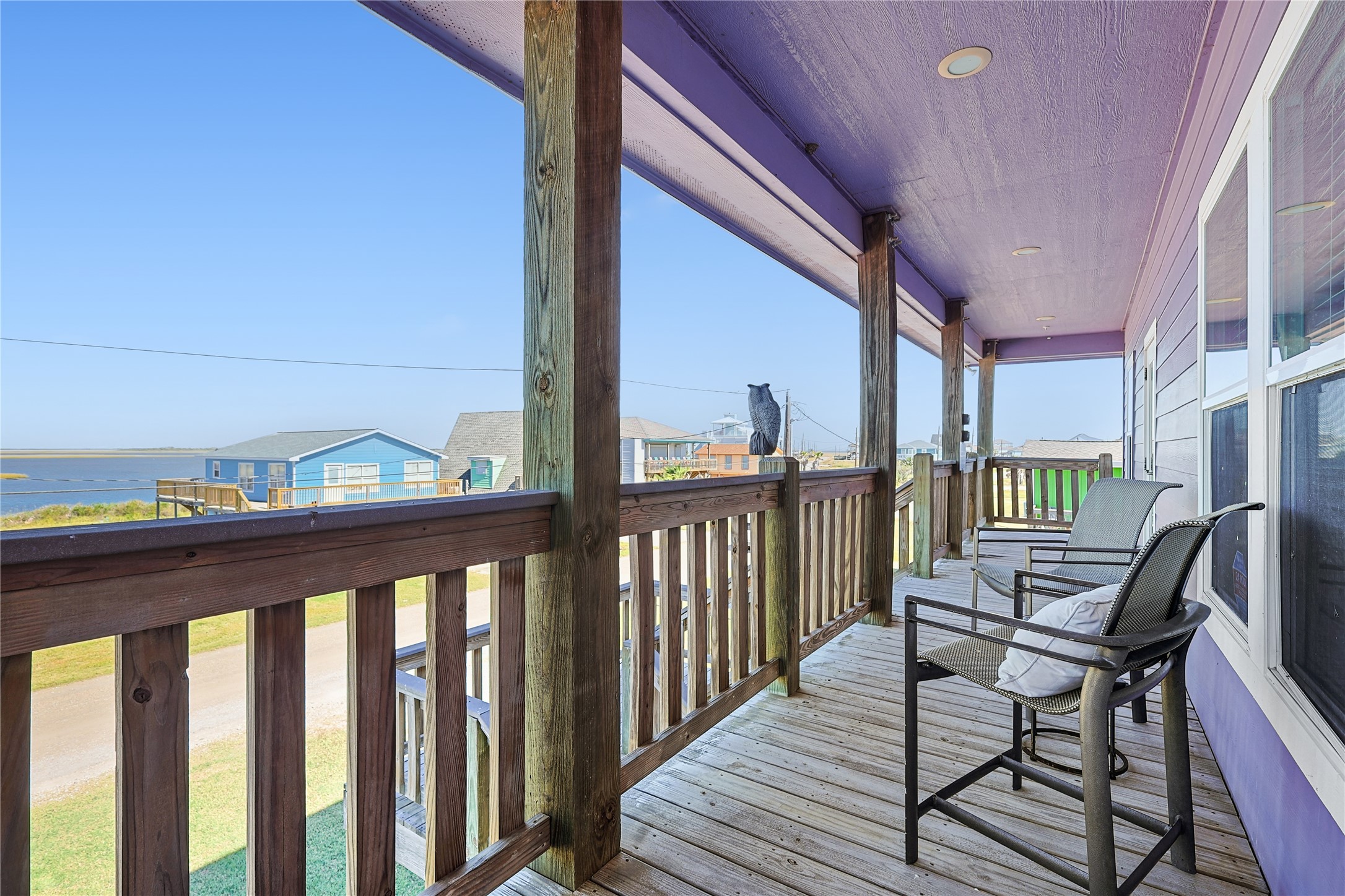 4414 Palm Street Freeport, TX 77541 - Photo 26 of 35 a view of a balcony with chairs and wooden floor