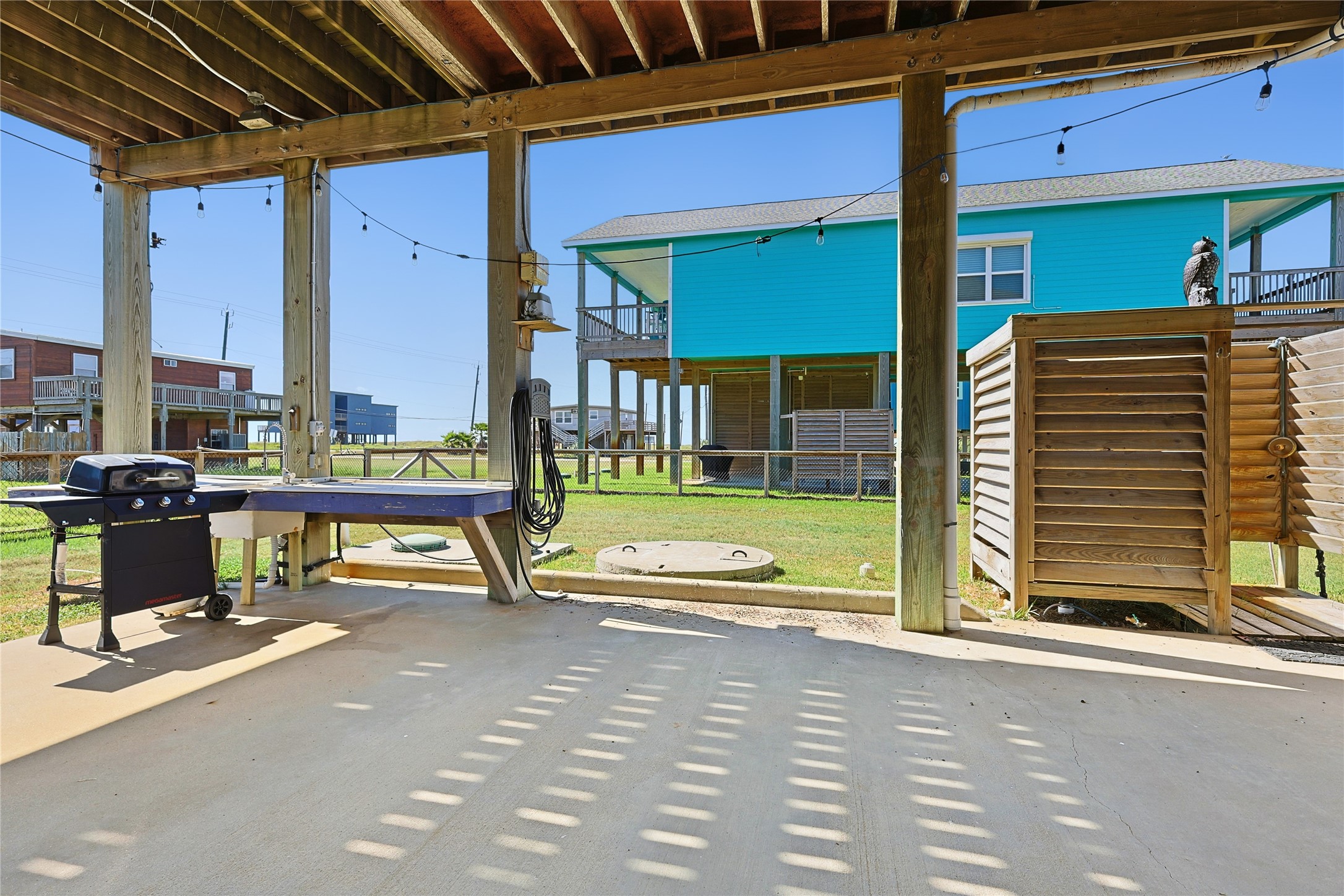 4414 Palm Street Freeport, TX 77541 - Photo 29 of 35 a view of a patio with a table and chairs