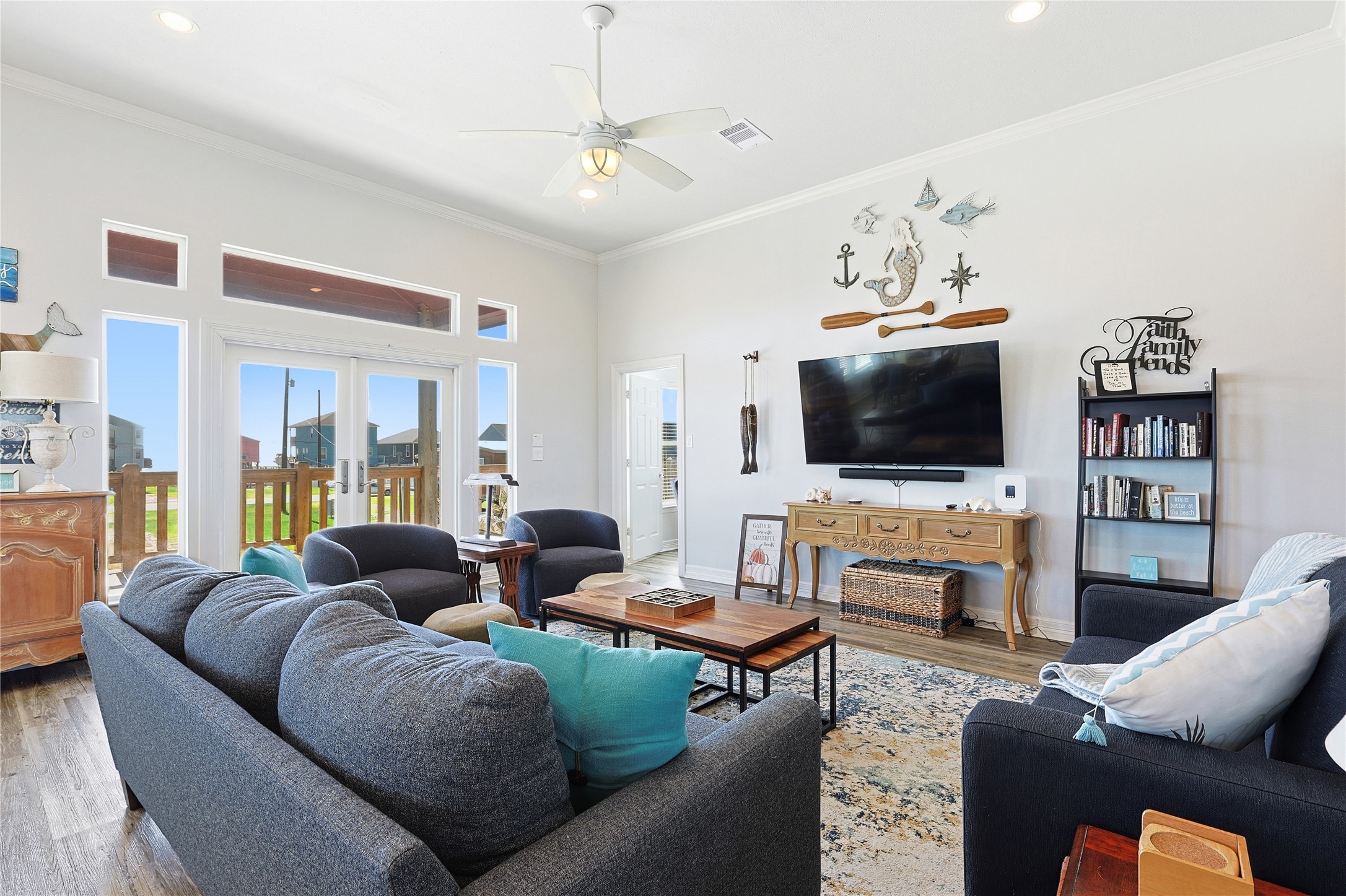 4414 Palm Street Freeport, TX 77541 - Photo 7 of 35 a living room with furniture ceiling fan and a flat screen tv