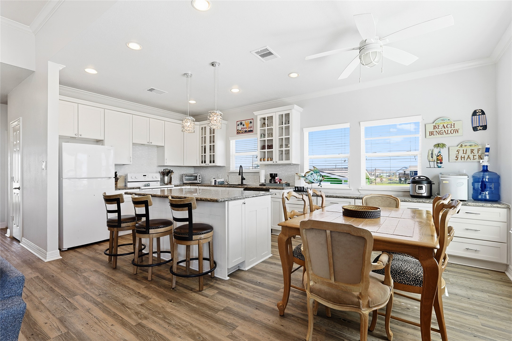 4414 Palm Street Freeport, TX 77541 - Photo 9 of 35 a kitchen with counter space dining table and appliances