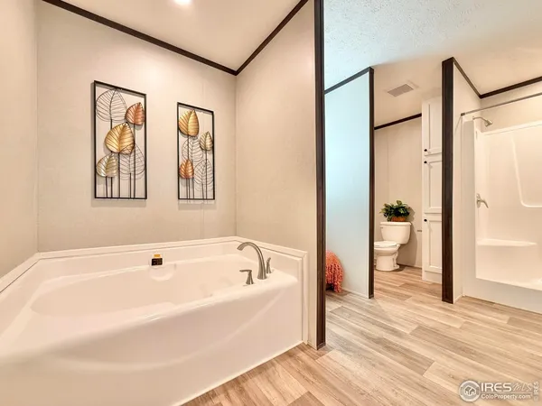 a white bath tub sitting next to a bathroom
