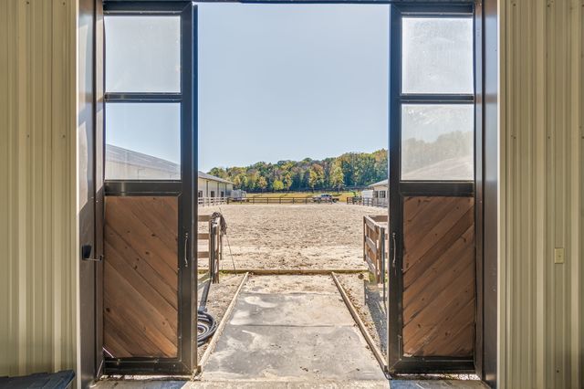 a view of a livingroom with furniture and windows