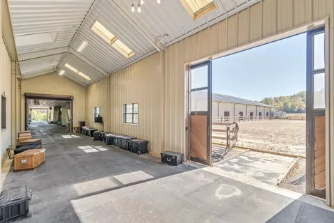 a room with lots of wooden furniture and a chandelier