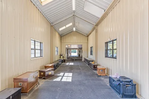 a large room with lots of counter space and chandelier