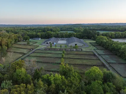 an aerial view of a golf course with parking space